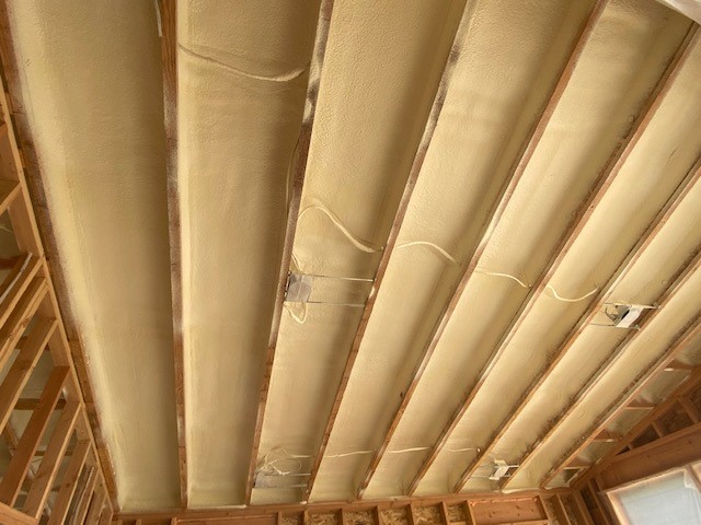 Spray foam insulation in the ceiling of a residence.