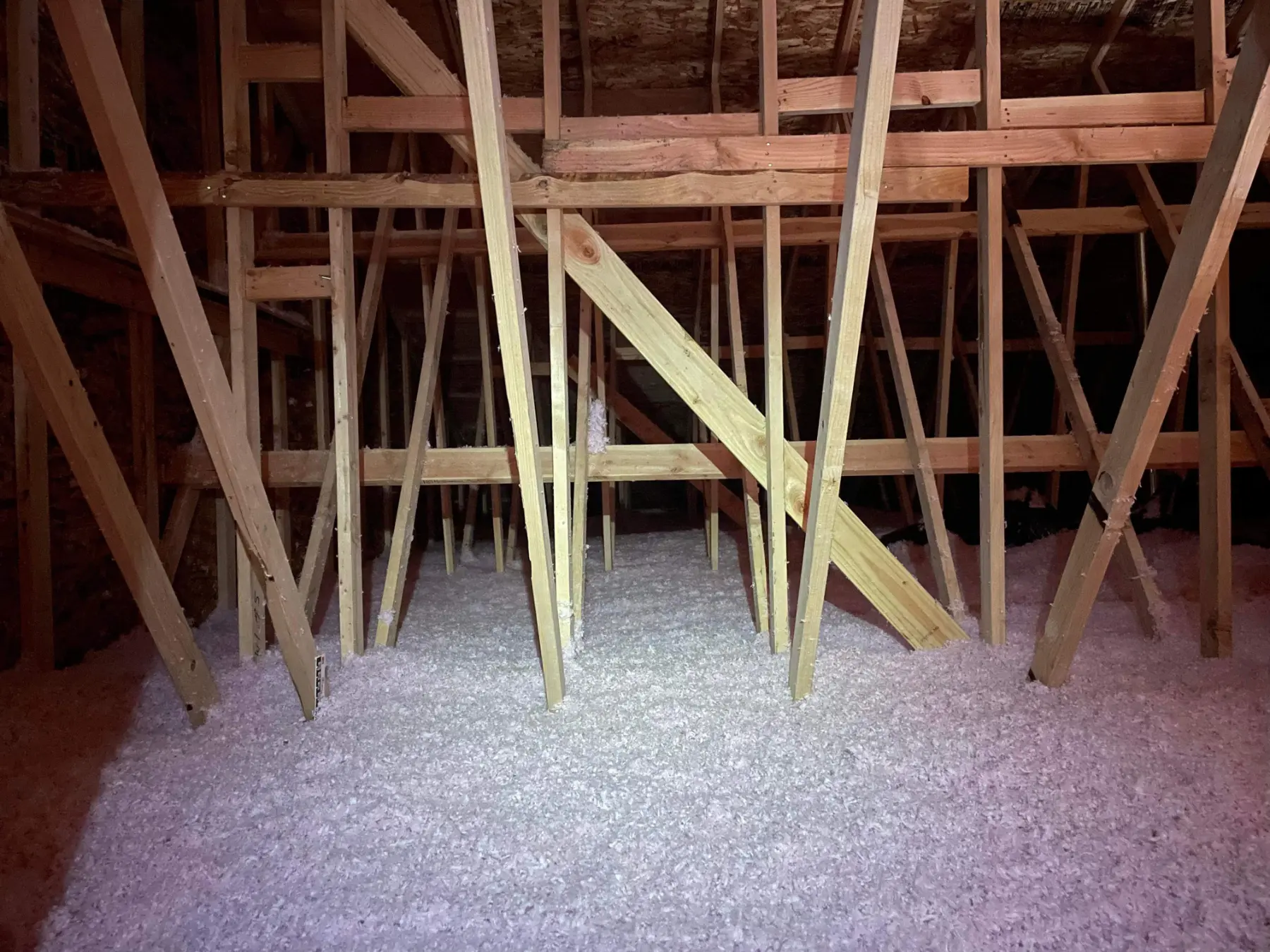 Blown insulation installed in an attic space.