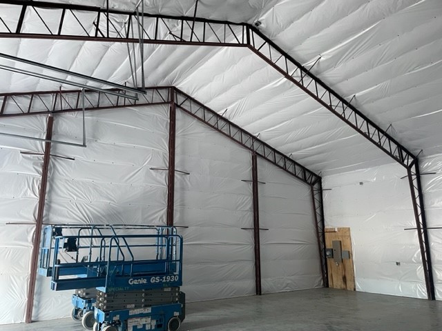 Large Storage Shop in Baker City OR with White WMPVRR Vapor Barrier insulation.