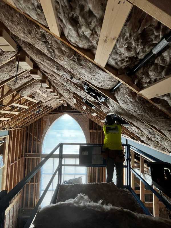 Fiberglass insulation installation at The Oaks Classical Christian Academy with T.W. Clark Construction