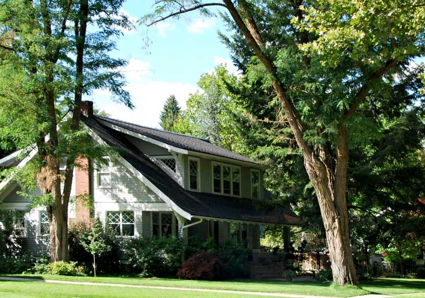 Beautiful Idaho, two-story home, with a green forest surrounding.